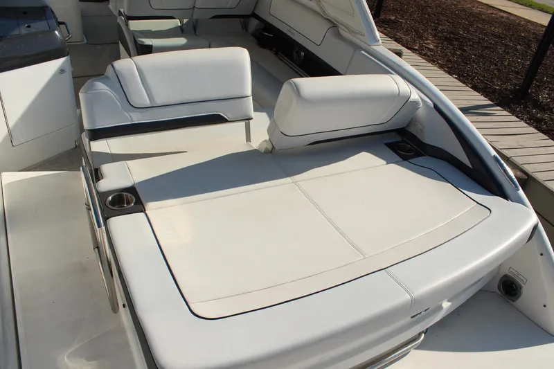 Slide: The Image of 2023 Formula 310 Bowrider I/O interior with spacious seating and cup holders. - 9