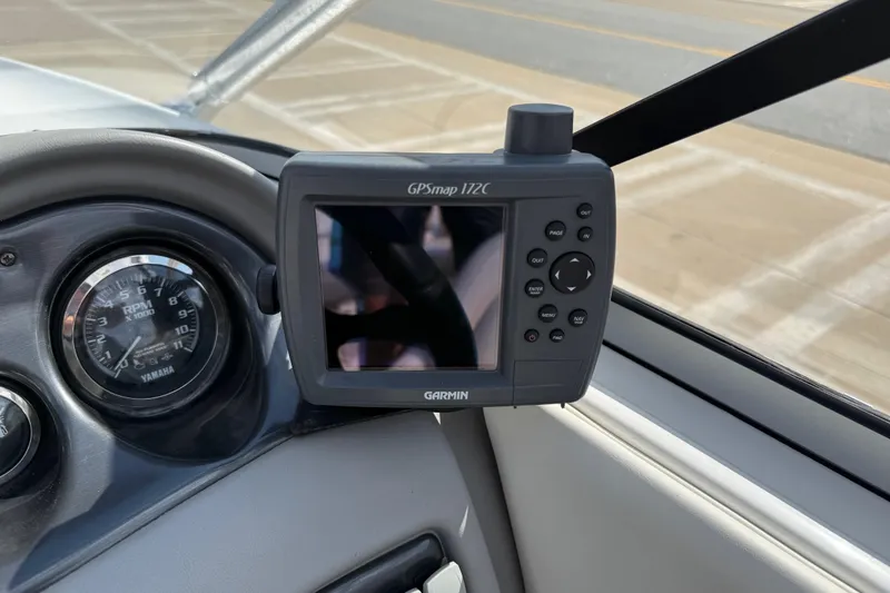 Slide: The Image of 2005 Yamaha SX230 boat dashboard with Garmin GPSmap 172C and Yamaha RPM gauge. - 13