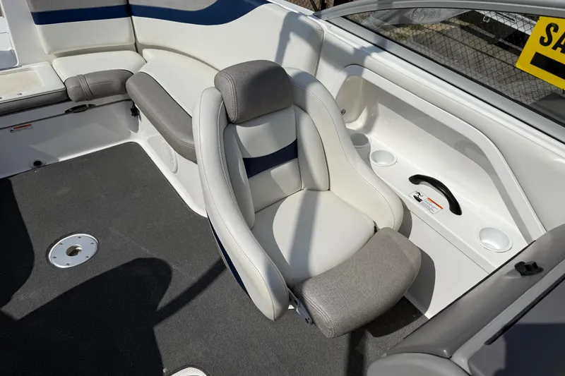 Slide: The Image of 2005 Yamaha Boats SX230 interior seating with gray and white upholstery. - 17