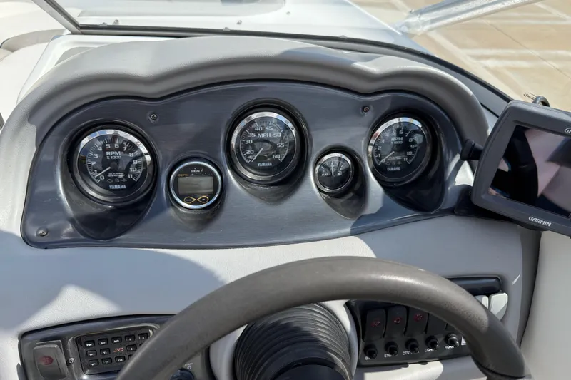 Slide: The Image of Dashboard of a 2005 Yamaha Boats SX230 with gauges and Garmin GPS. - 21