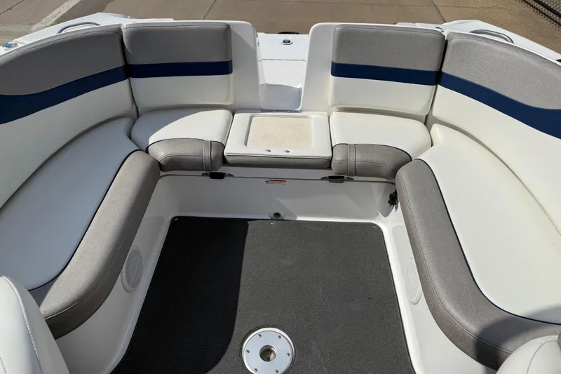Slide: The Image of 2005 Yamaha Boats SX230 interior with gray and white seating, blue accents. - 23