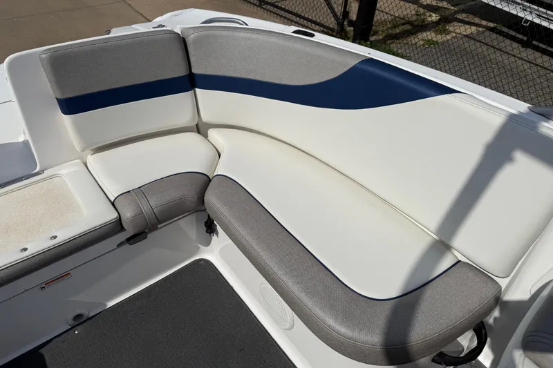 Slide: The Image of 2005 Yamaha Boats SX230 interior seating with gray and blue upholstery. - 25