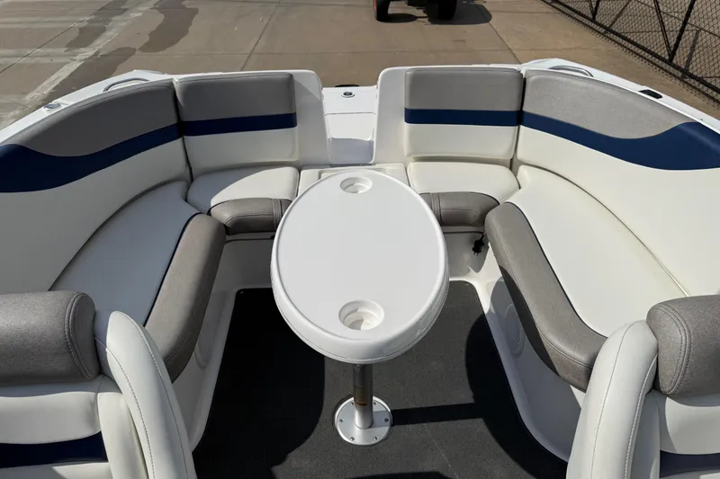 Slide: The Image of 2005 Yamaha Boats SX230 interior with cushioned seating and a central table. - 27