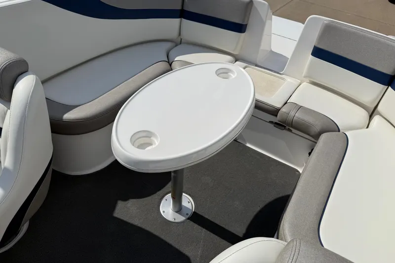 Slide: The Image of 2005 Yamaha Boats SX230 interior with seating and oval table. - 28