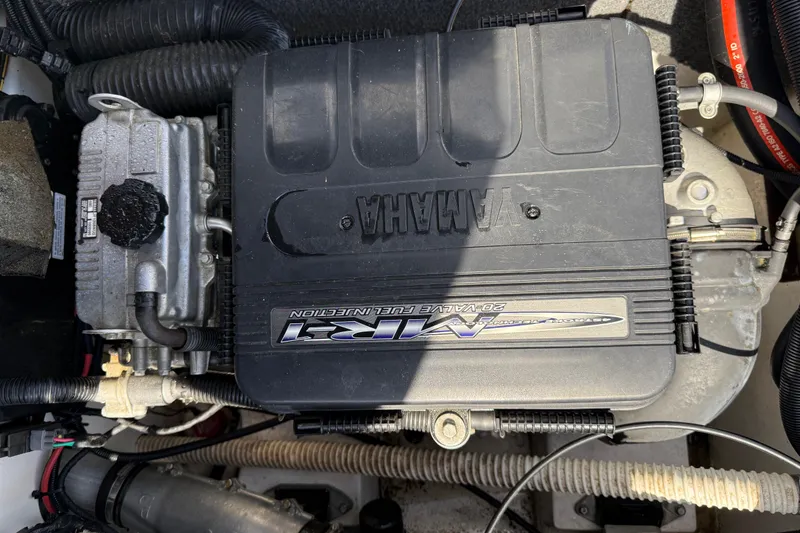 Slide: The Image of Engine compartment of a 2005 Yamaha Boats SX230, featuring a visible Yamaha engine. - 33