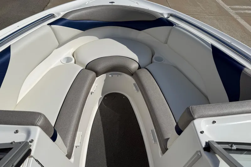 Slide: The Image of 2005 Yamaha Boats SX230 interior with cushioned seating and cup holders. - 37