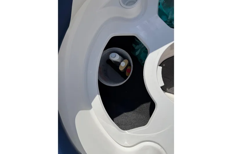 Slide: The Image of 2005 Yamaha Boats SX230 cup holder with bottles and accessories. - 39