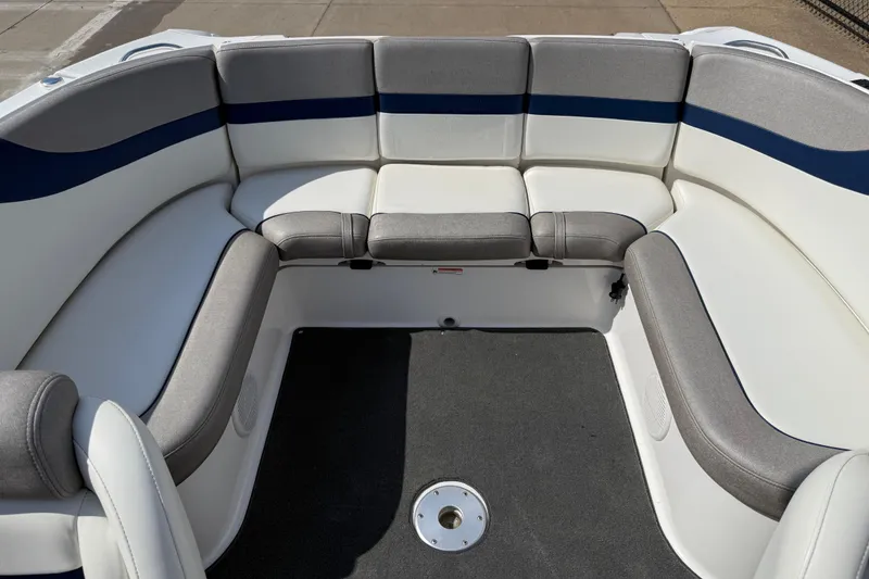 Slide: The Image of 2005 Yamaha Boats SX230 interior with gray and white seating, blue accents. - 41