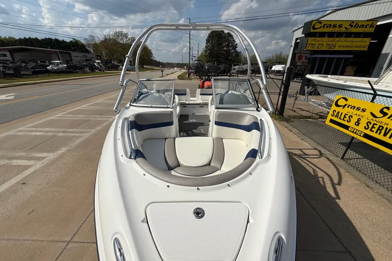 Slide: The Image of 2005 Yamaha Boats SX230 displayed at dealership, front view with seating and windshield. - 7