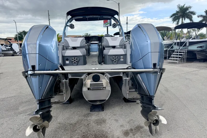 Slide: The Image of 2026 Avalon 2 boat with dual outboard motors, sleek design, and spacious seating. - 10