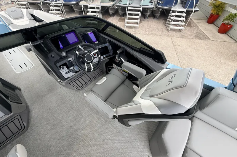 Slide: The Image of Interior of 2026 Avalon 2 boat with modern dashboard and luxurious seating. - 22