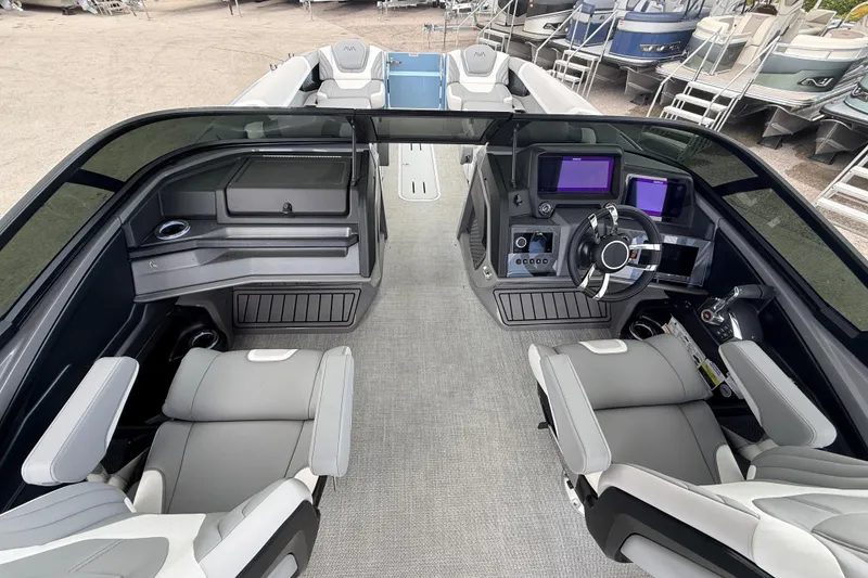 Slide: The Image of Luxurious 2026 Avalon 2 boat interior with modern dashboard and comfortable seating. - 24