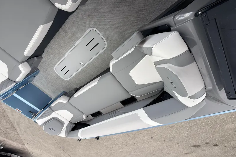 Slide: The Image of Interior of 2026 Avalon 2 boat with sleek gray and white seating design. - 25