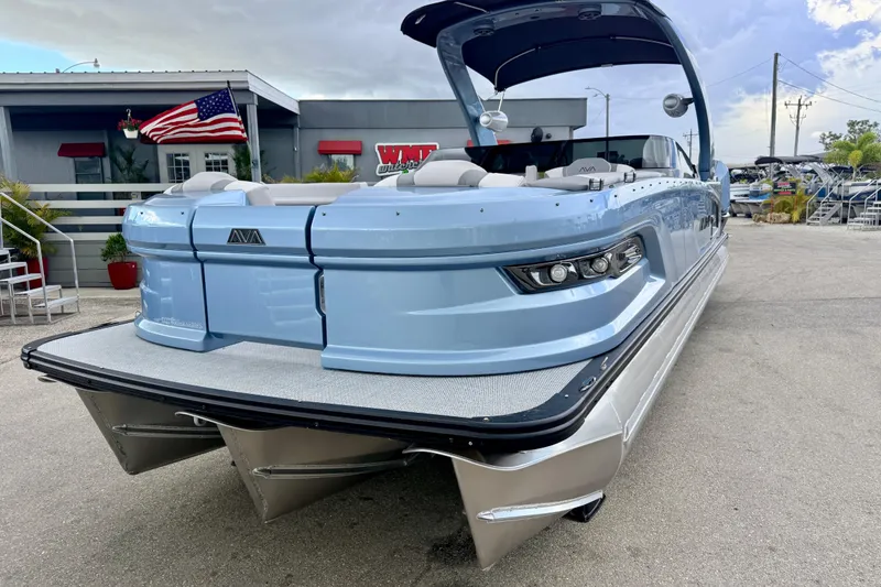 Slide: The Image of 2026 Avalon 2 pontoon boat with sleek design and modern features, docked outdoors. - 3