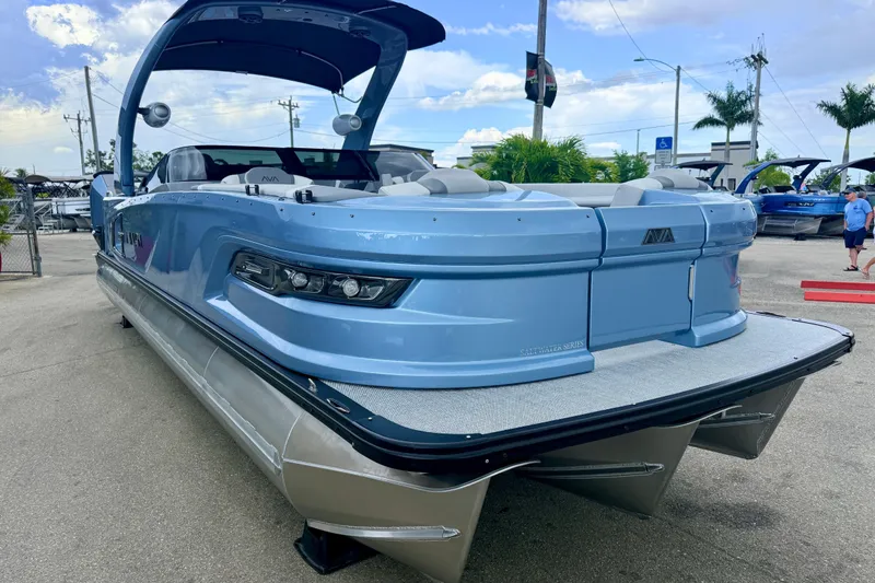 Slide: The Image of 2026 Avalon 2 pontoon boat in a marina, showcasing sleek design and modern features. - 5