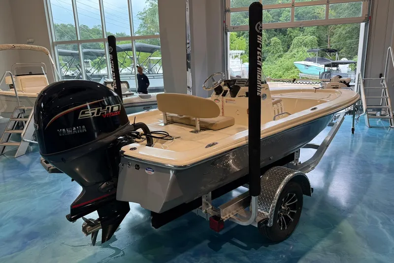 Slide: The Image of 2026 Scout 177 XSS boat with Yamaha engine on display in showroom. - 4