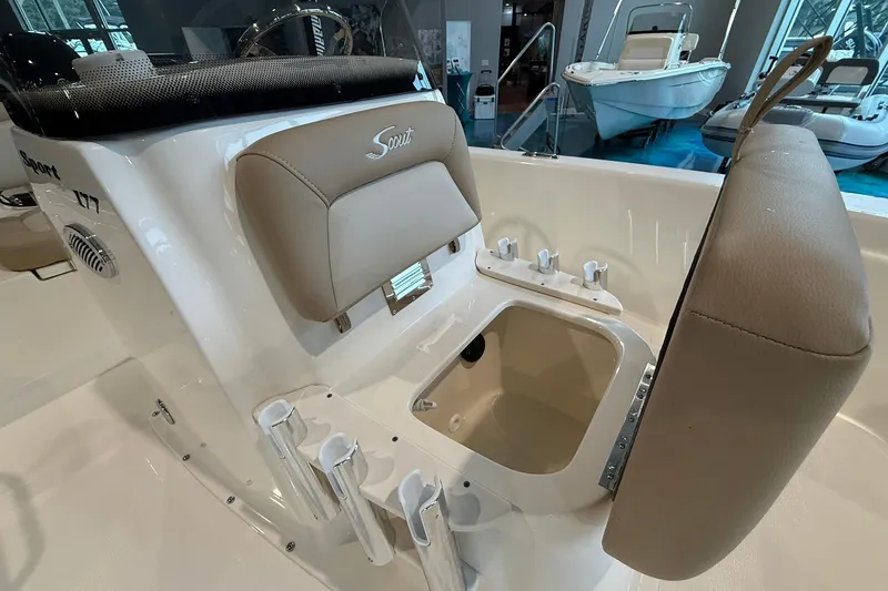 Slide: The Image of 2026 Scout 177 XSS boat interior with storage compartment and rod holders. - 7