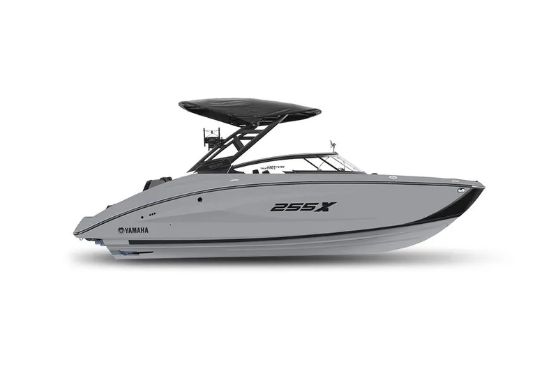 The Image of 2024 Yamaha Boats 255XE in marina, featuring sleek design and spacious seating. - 0