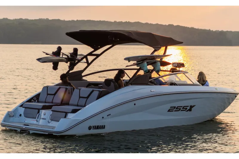 Slide: The Image of 2024 Yamaha Boats 255XE docked, featuring sleek design and spacious seating. - 1