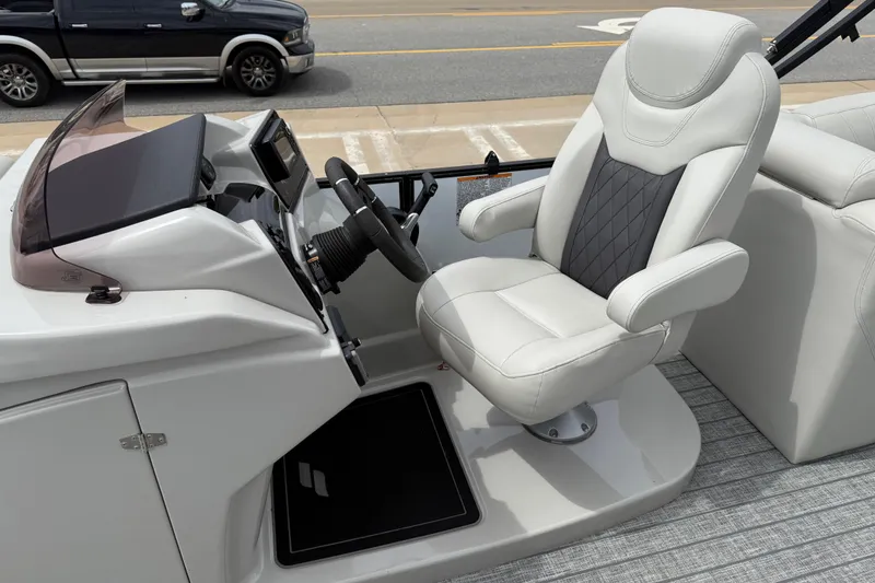 Slide: The Image of Captain's seat and helm of 2022 Starcraft SLS 3 boat, featuring modern controls and design. - 15
