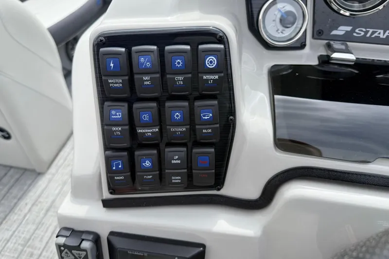 Slide: The Image of Control panel of 2022 Starcraft SLS 3 boat with various function buttons. - 21
