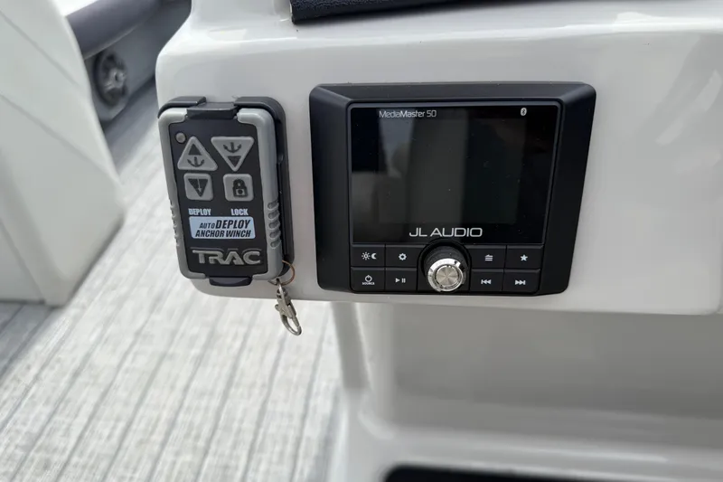 Slide: The Image of Control panel of a 2022 Starcraft SLS 3 with JL Audio system and TRAC anchor winch. - 22