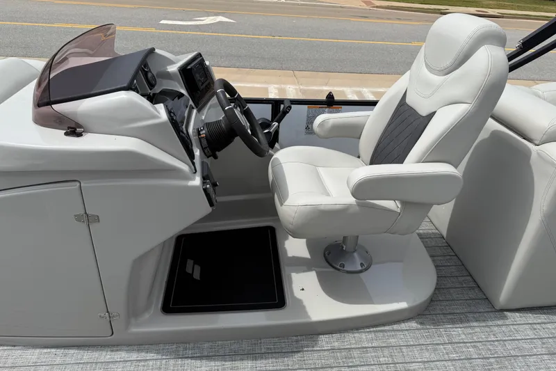 Slide: The Image of Captain's seat and helm of 2022 Starcraft SLS 3 boat, featuring modern controls and design. - 24