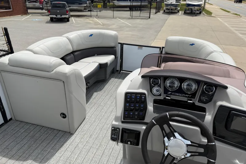 Slide: The Image of Interior view of a 2022 Starcraft SLS 3 boat with plush seating and modern dashboard. - 29
