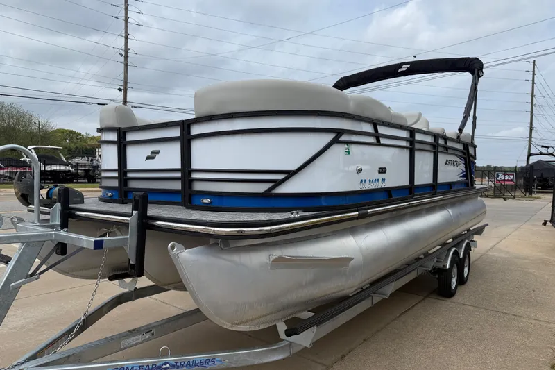 Slide: The Image of 2022 Starcraft SLS 3 pontoon boat on trailer, featuring sleek design and modern amenities. - 3