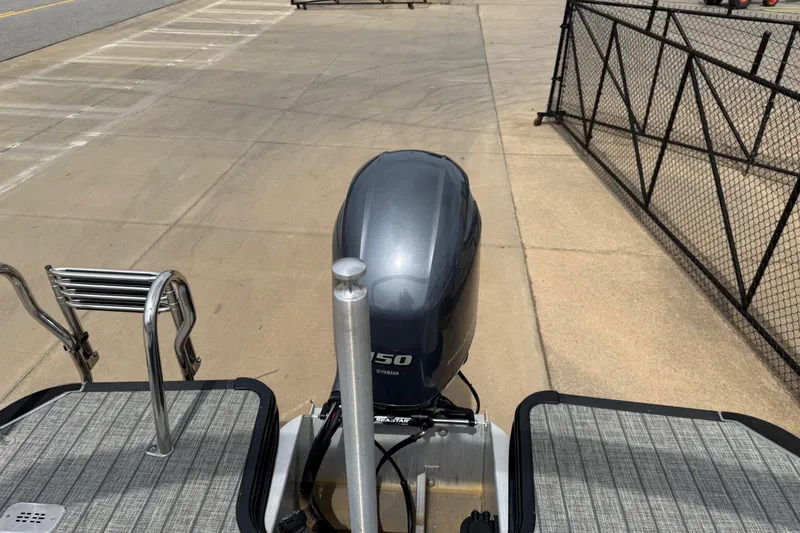 Slide: The Image of 2022 Starcraft SLS 3 boat with Yamaha 150 outboard motor on a concrete surface. - 31