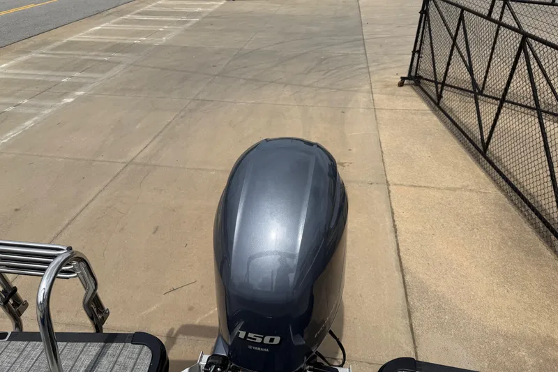 Slide: The Image of 2022 Starcraft SLS 3 boat with Yamaha 150 engine on a concrete surface. - 32