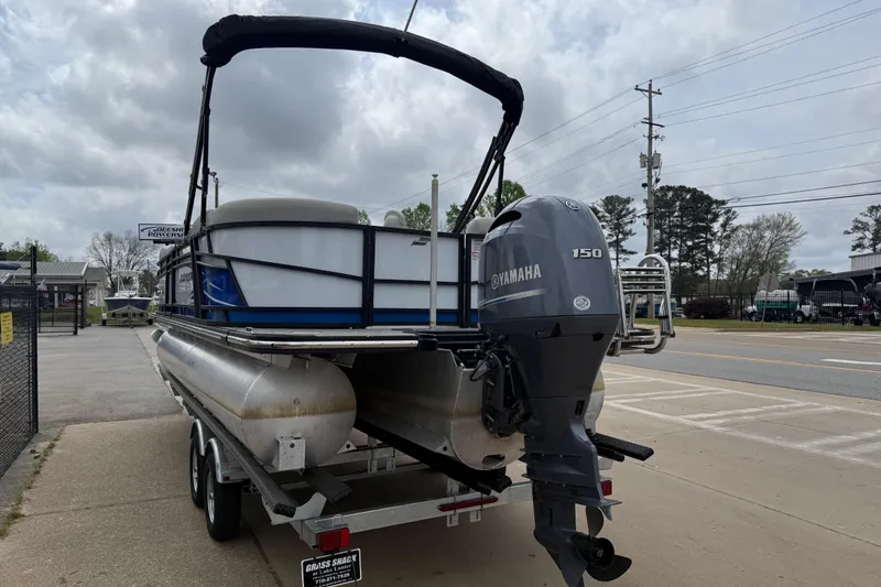Slide: The Image of 2022 Starcraft SLS 3 pontoon boat with Yamaha 150 engine on a trailer. - 7