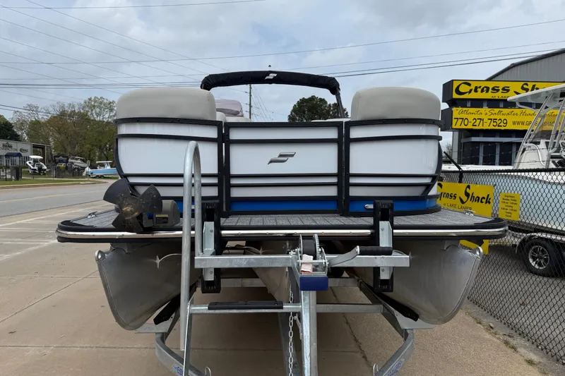 Slide: The Image of 2022 Starcraft SLS 3 pontoon boat on trailer at dealership. - 8