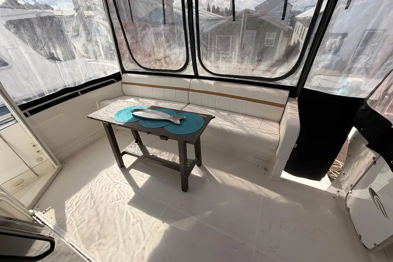 Slide: The Image of Interior of 2005 Carver 41 Cockpit Motor Yacht with seating and table. - 10