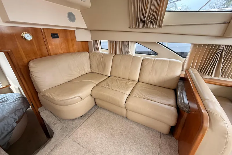 Slide: The Image of Luxurious beige leather seating in 2005 Carver 41 Cockpit Motor Yacht interior. - 26