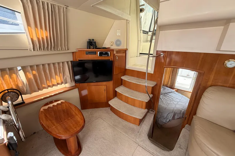 Slide: The Image of Interior of 2005 Carver 41 Cockpit Motor Yacht with cozy seating and modern amenities. - 27