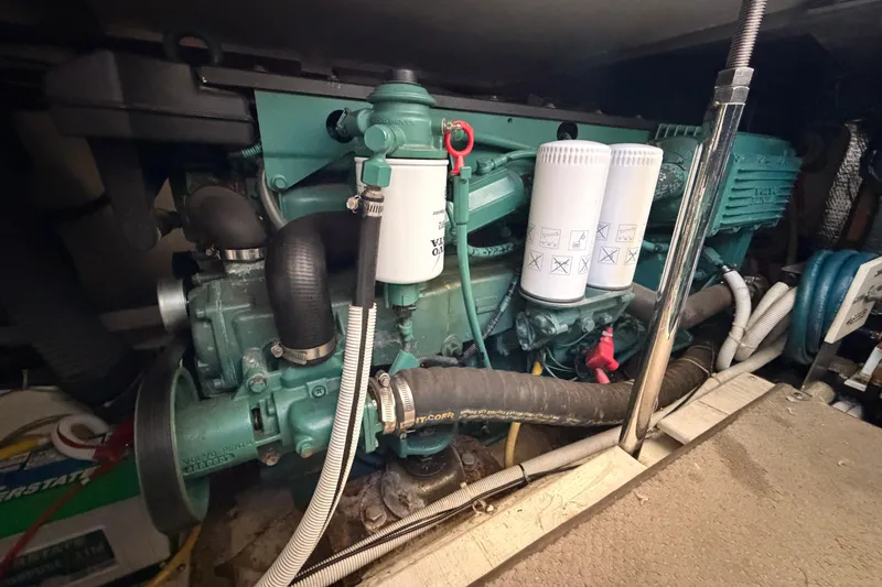 Slide: The Image of Engine room of 2005 Carver 41 Cockpit Motor Yacht with visible components and filters. - 39