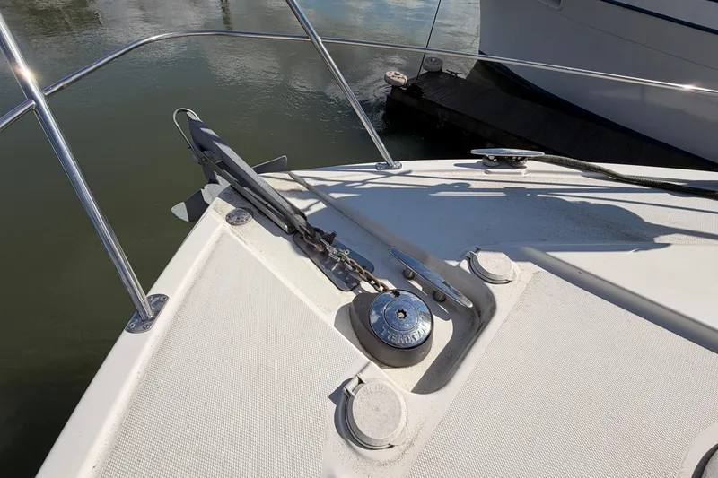 Slide: The Image of Bow of 2005 Carver 41 Cockpit Motor Yacht with anchor and winch. - 8