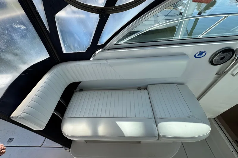 Slide: The Image of Interior seating of 2011 Glacier Bay 2670 Cuddy boat with white upholstery. - 15