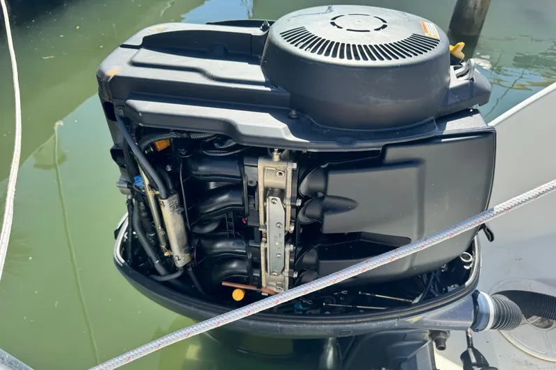 Slide: The Image of 2011 Glacier Bay 2670 Cuddy outboard motor, partially submerged in water. - 24