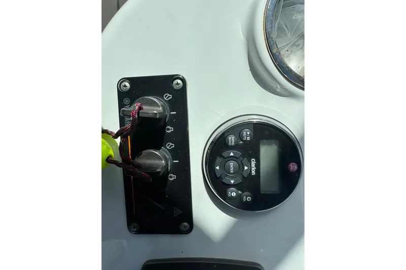 Slide: The Image of Control panel of a 2011 Glacier Bay 2670 Cuddy boat with Clarion audio system. - 29