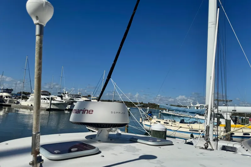 Slide: The Image of 2011 Glacier Bay 2670 Cuddy boat docked at marina under clear blue sky. - 32