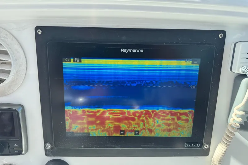 Slide: The Image of Raymarine fishfinder display on 2011 Glacier Bay 2670 Cuddy boat dashboard. - 33