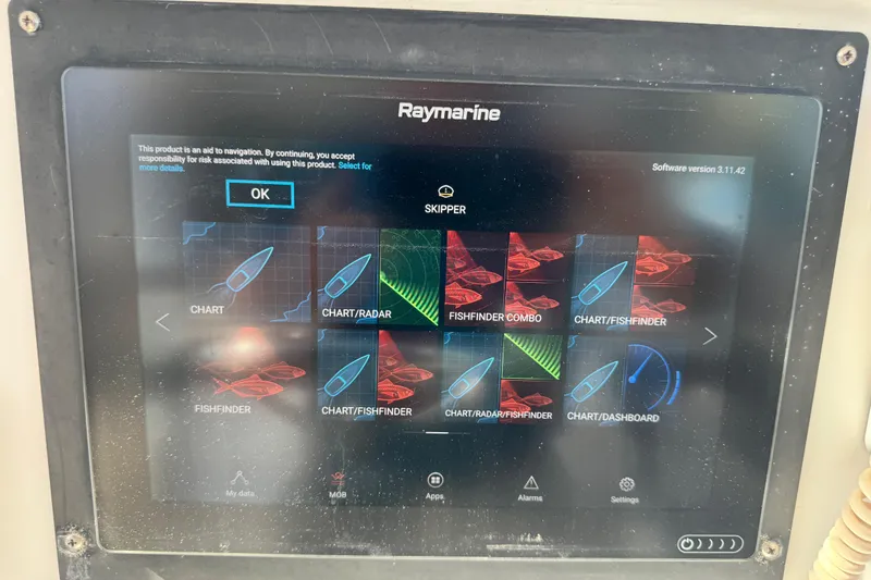 Slide: The Image of Raymarine navigation display on 2011 Glacier Bay 2670 Cuddy, showing chart and fishfinder options. - 34