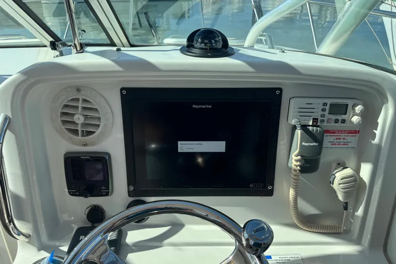 Slide: The Image of Control panel of 2011 Glacier Bay 2670 Cuddy boat with Raymarine electronics. - 35