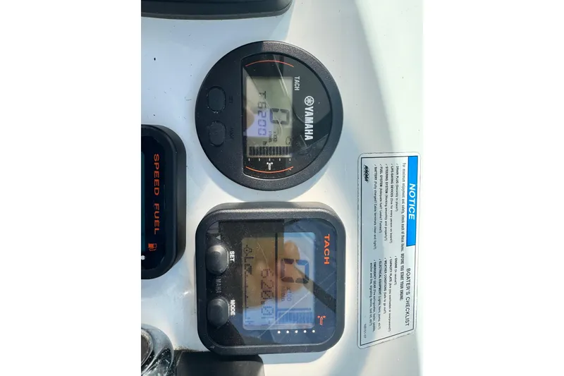 Slide: The Image of Yamaha tachometer and speed fuel gauges on 2011 Glacier Bay 2670 Cuddy boat dashboard. - 36