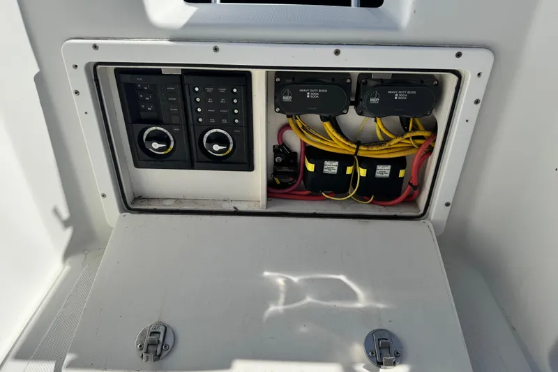 Slide: The Image of Electrical panel of 2011 Glacier Bay 2670 Cuddy boat, featuring switches and wiring. - 37