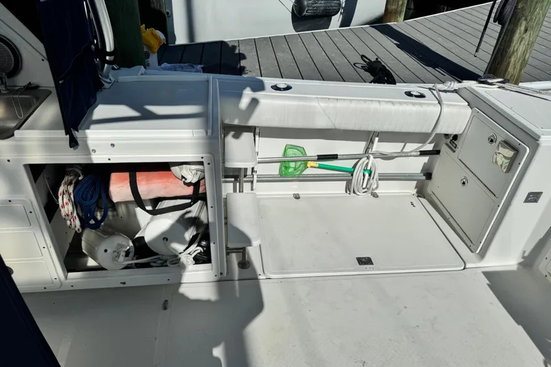 Slide: The Image of 2011 Glacier Bay 2670 Cuddy boat deck with storage compartments and marine equipment. - 39