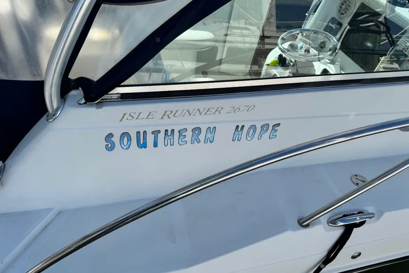 Slide: The Image of 2011 Glacier Bay 2670 Cuddy boat named "Southern Hope" with visible steering wheel. - 4