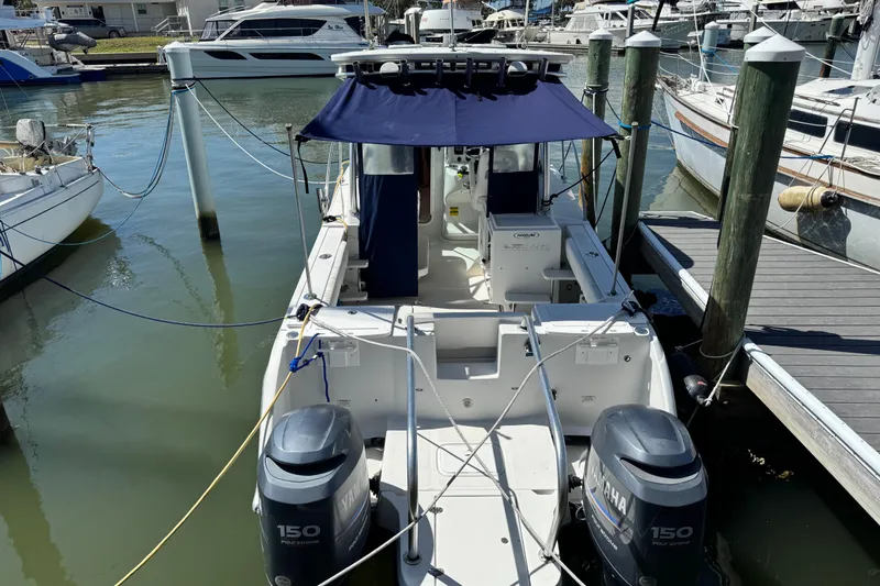Slide: The Image of 2011 Glacier Bay 2670 Cuddy boat docked with twin Yamaha 150 engines. - 44